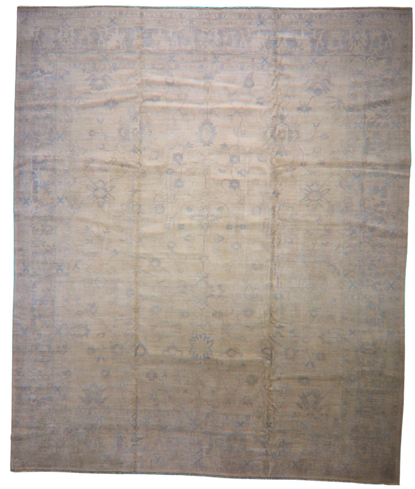 Beige and brown patterned rug on a white background