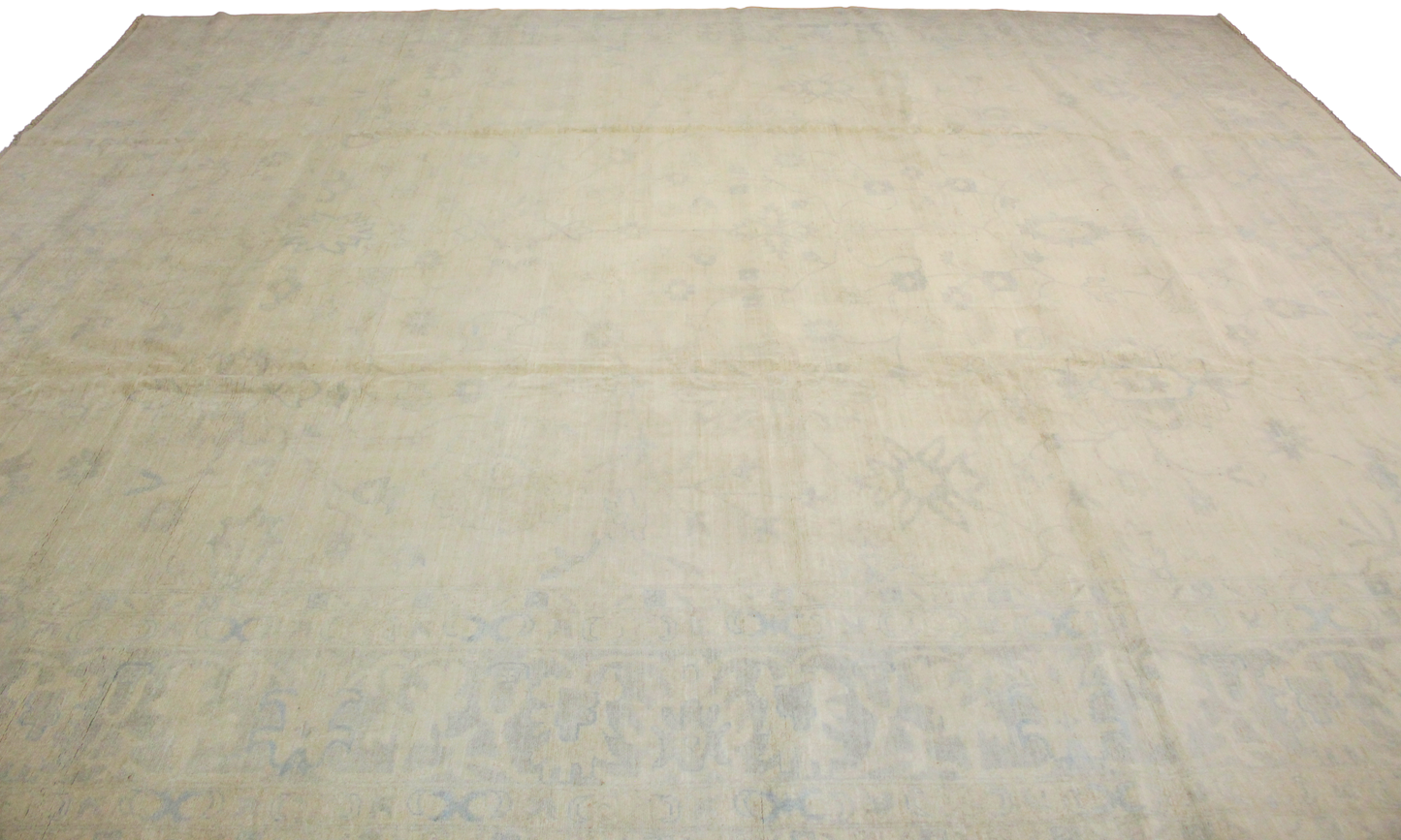 Beige quilt with a textured pattern on a white background