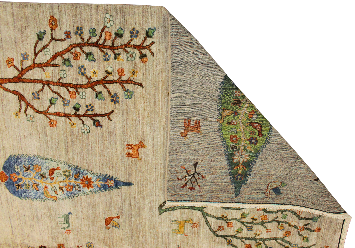 Close-up of a textured fabric with embroidered patterns on a beige and gray background.