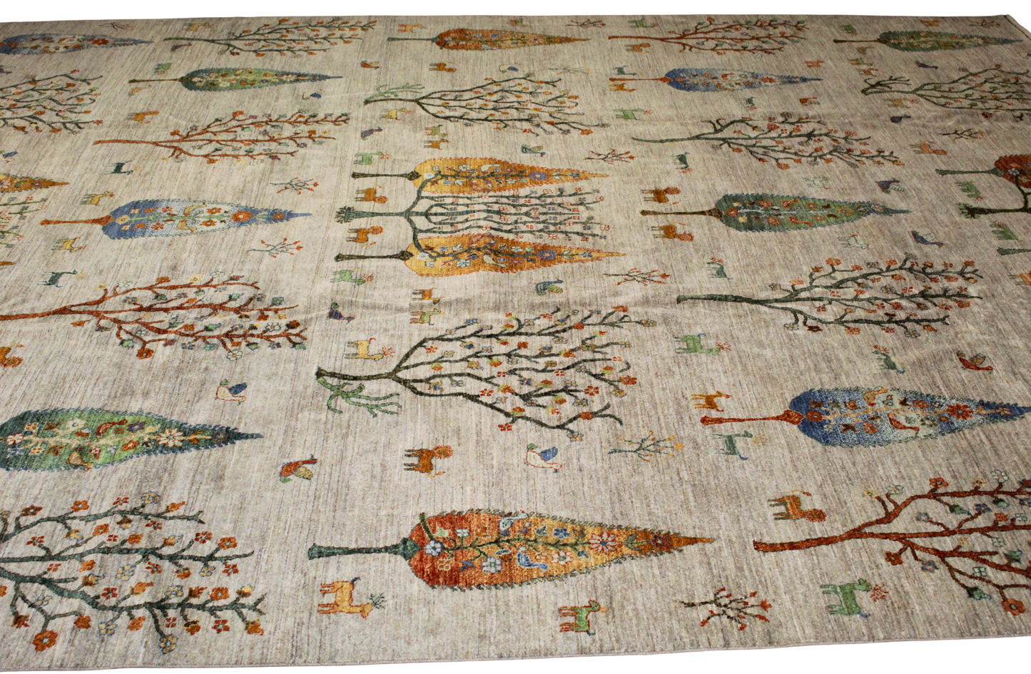 Decorative rug with tree patterns on a beige background