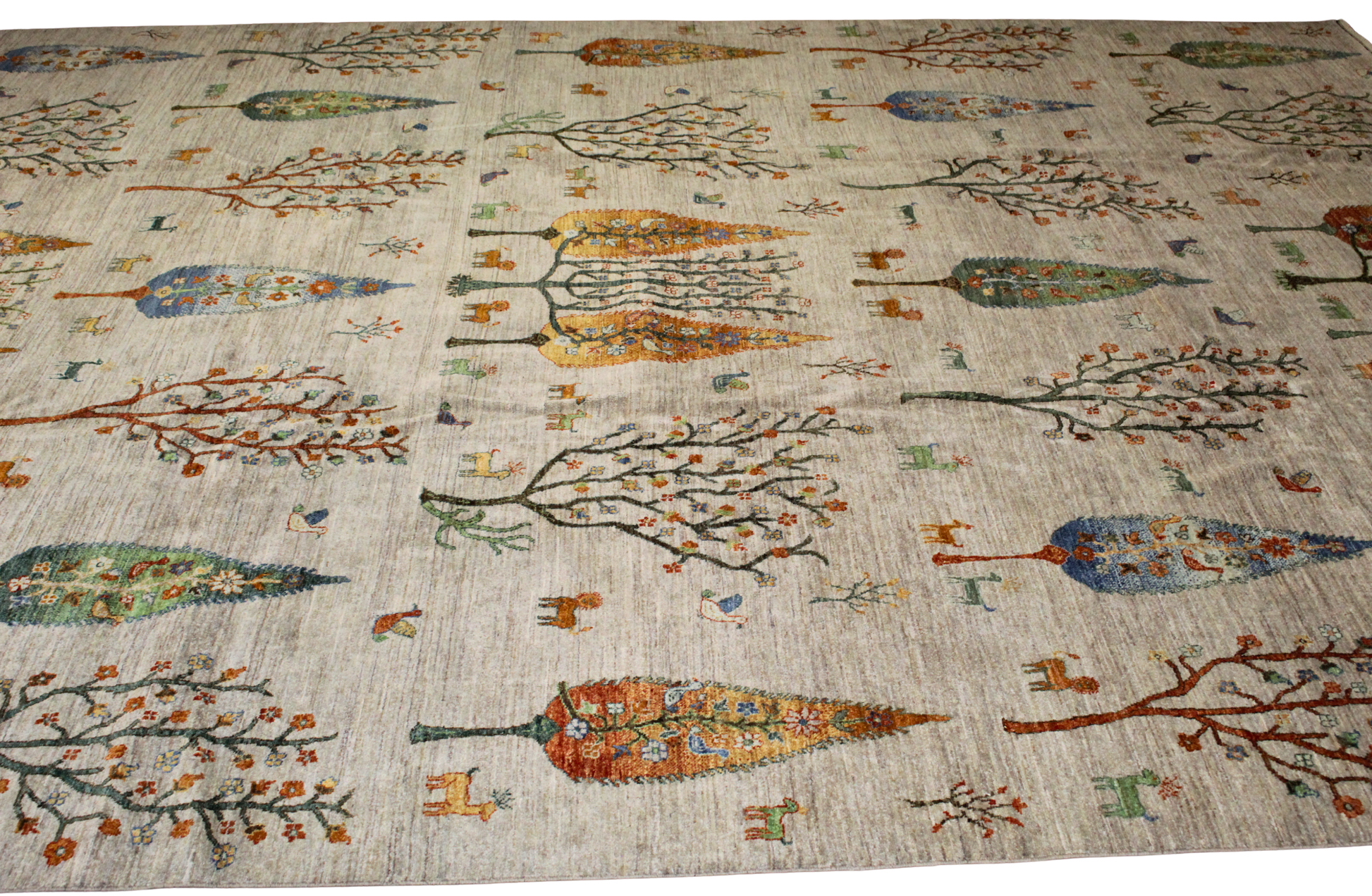 Decorative rug with tree patterns on a beige background