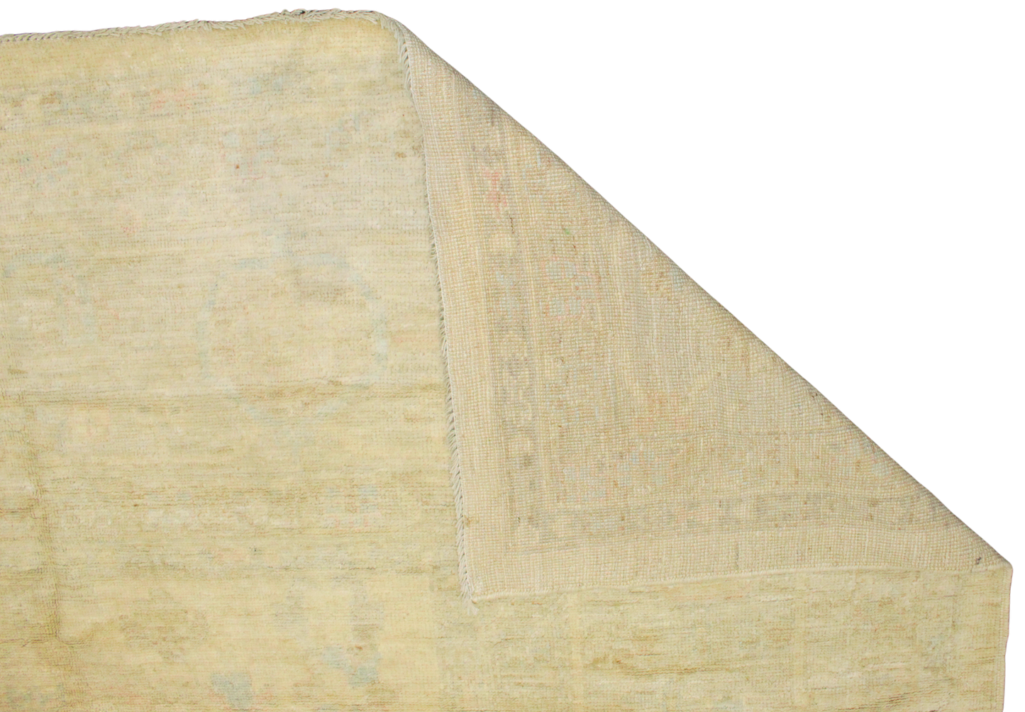 Beige textured rug corner on a white background