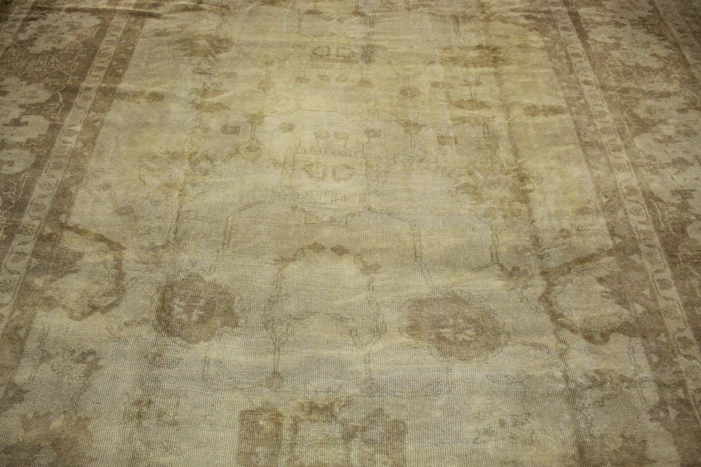 Handmade Oushak rug in muted neutral tones