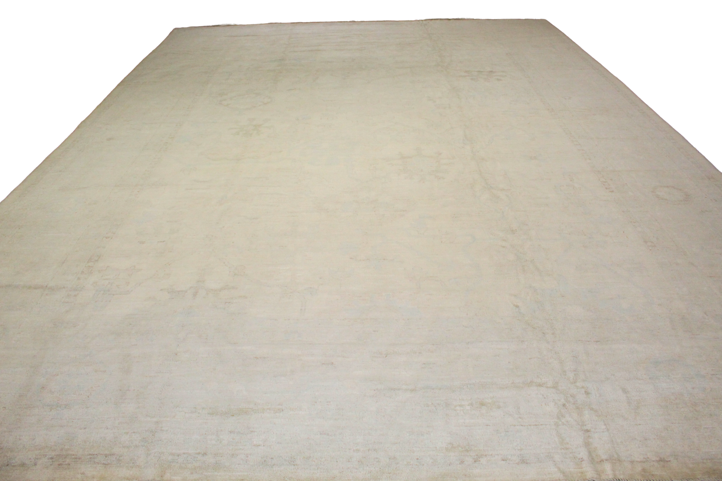 Beige quilted blanket on a white background