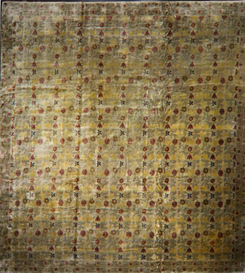 Patterned rug with a mix of colors on a textured surface