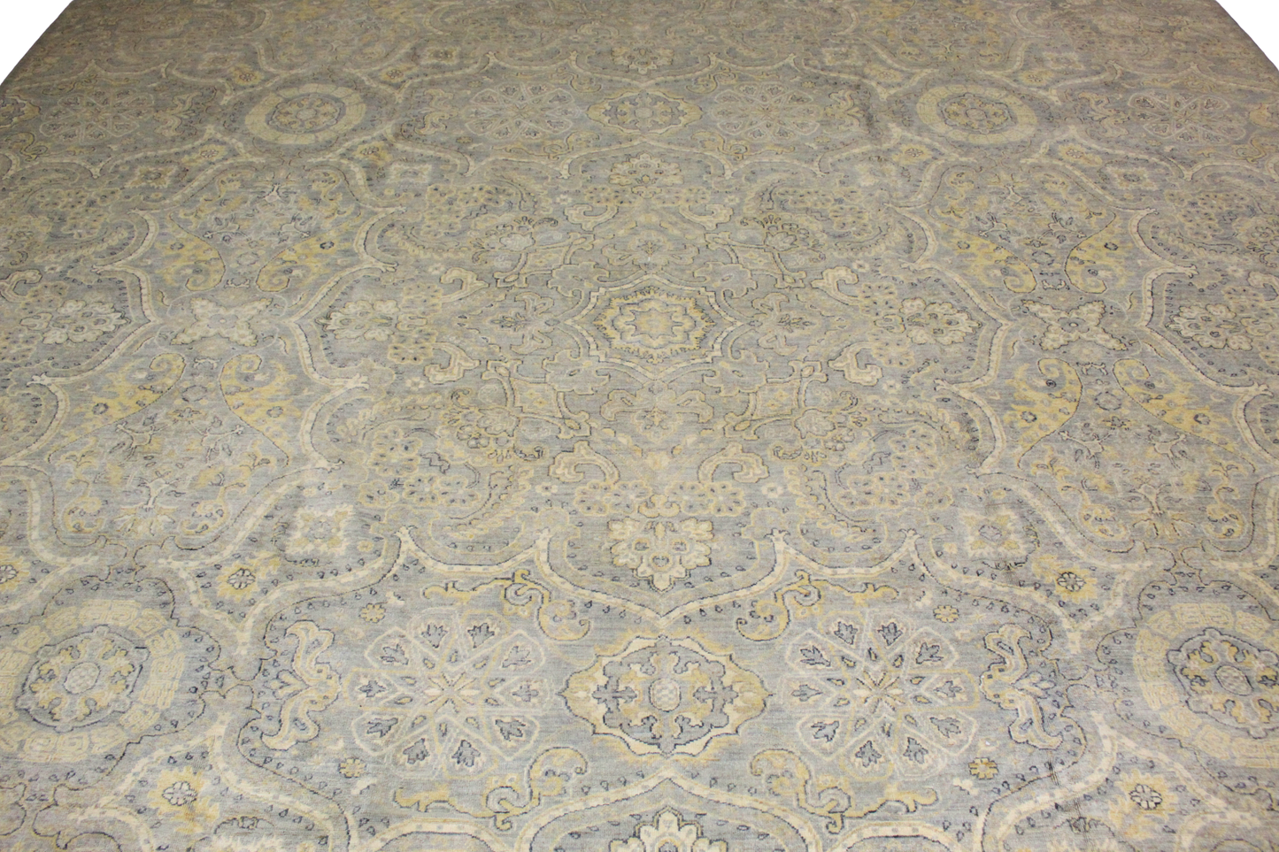 Patterned rug with intricate design on a neutral background