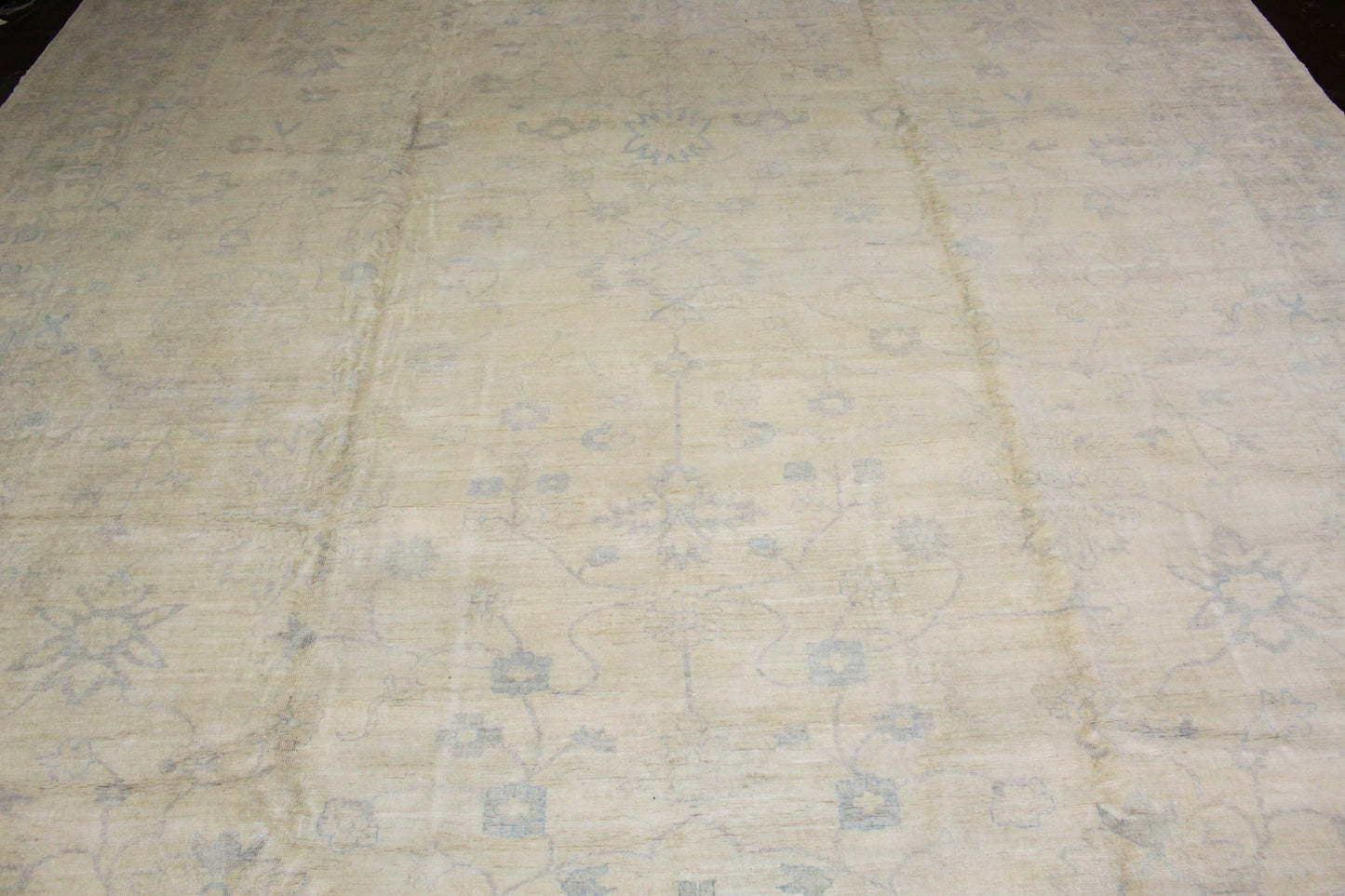 Textured beige fabric with a subtle pattern