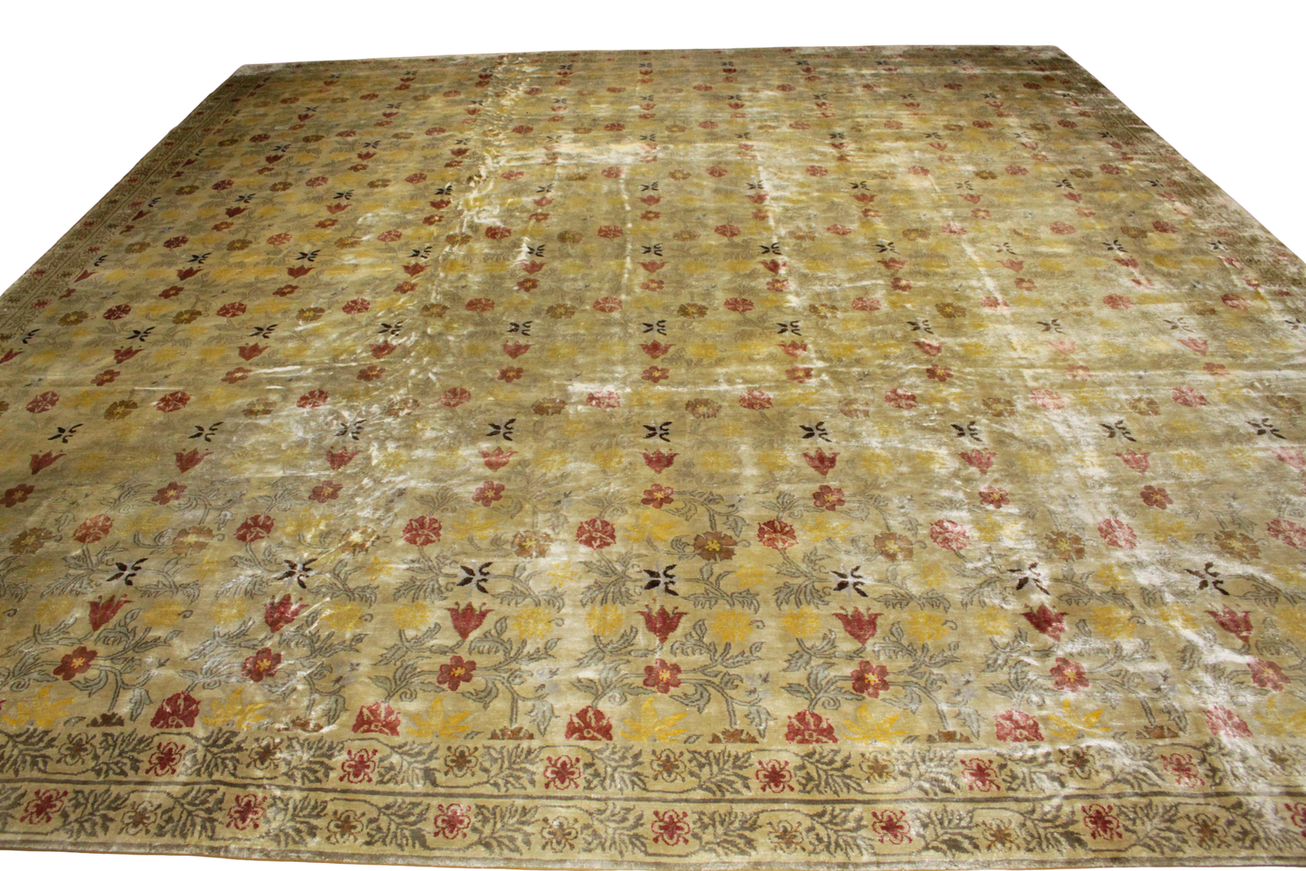 Vintage floral-patterned rug with a beige background