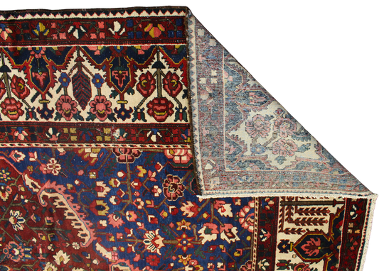 14x16 wool Persian rug with floral and tribal motifs