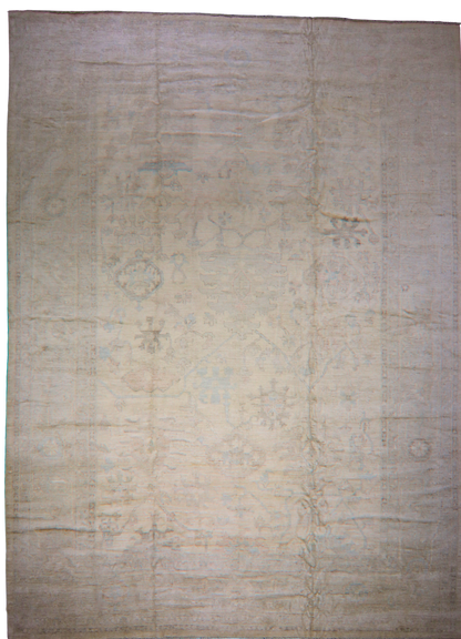 Beige area rug with subtle patterns on a plain background
