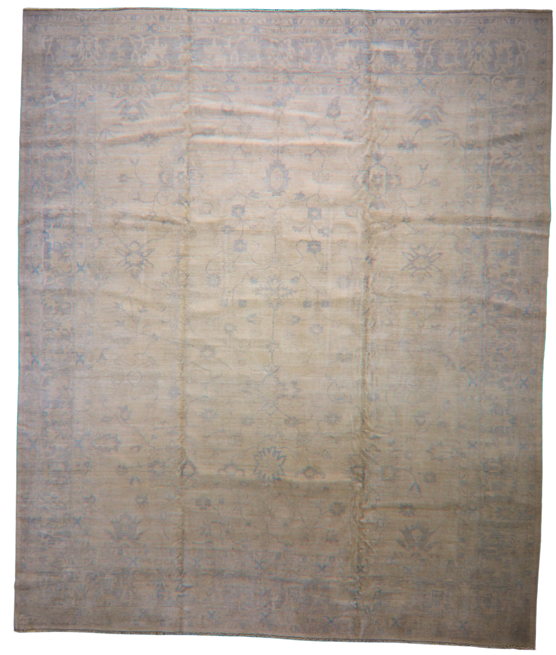 Beige and brown patterned rug on a white background
