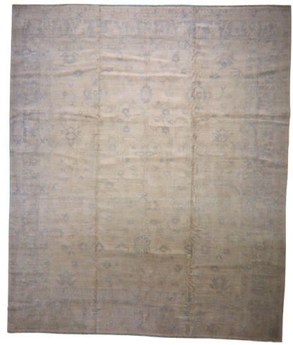 Beige and brown patterned rug on a white background