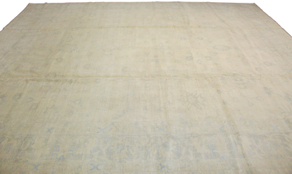 Beige quilt with a textured pattern on a white background