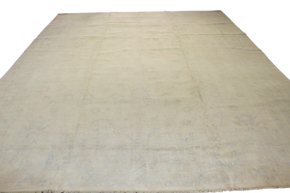 Beige rug with a subtle pattern on a white background