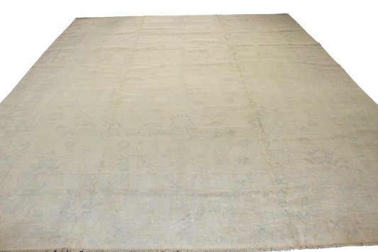 Beige rug with a subtle pattern on a white background