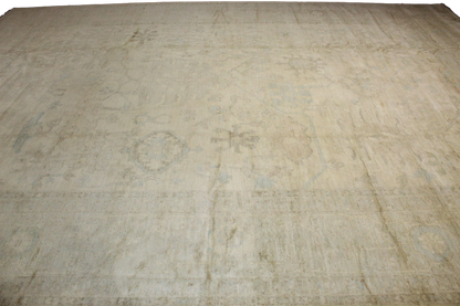 Beige rug with a textured pattern on a plain background