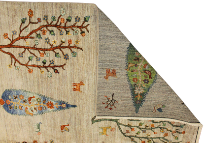 Close-up of a textured fabric with embroidered patterns on a beige and gray background.