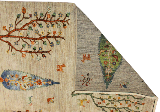 Close-up of a textured fabric with embroidered patterns on a beige and gray background.
