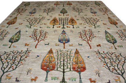 Decorative rug with tree and animal pattern on a plain background