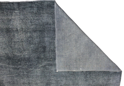 Gray textured rug corner on a white background