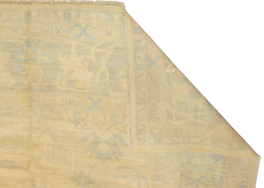 Patterned rug with geometric design on a plain background