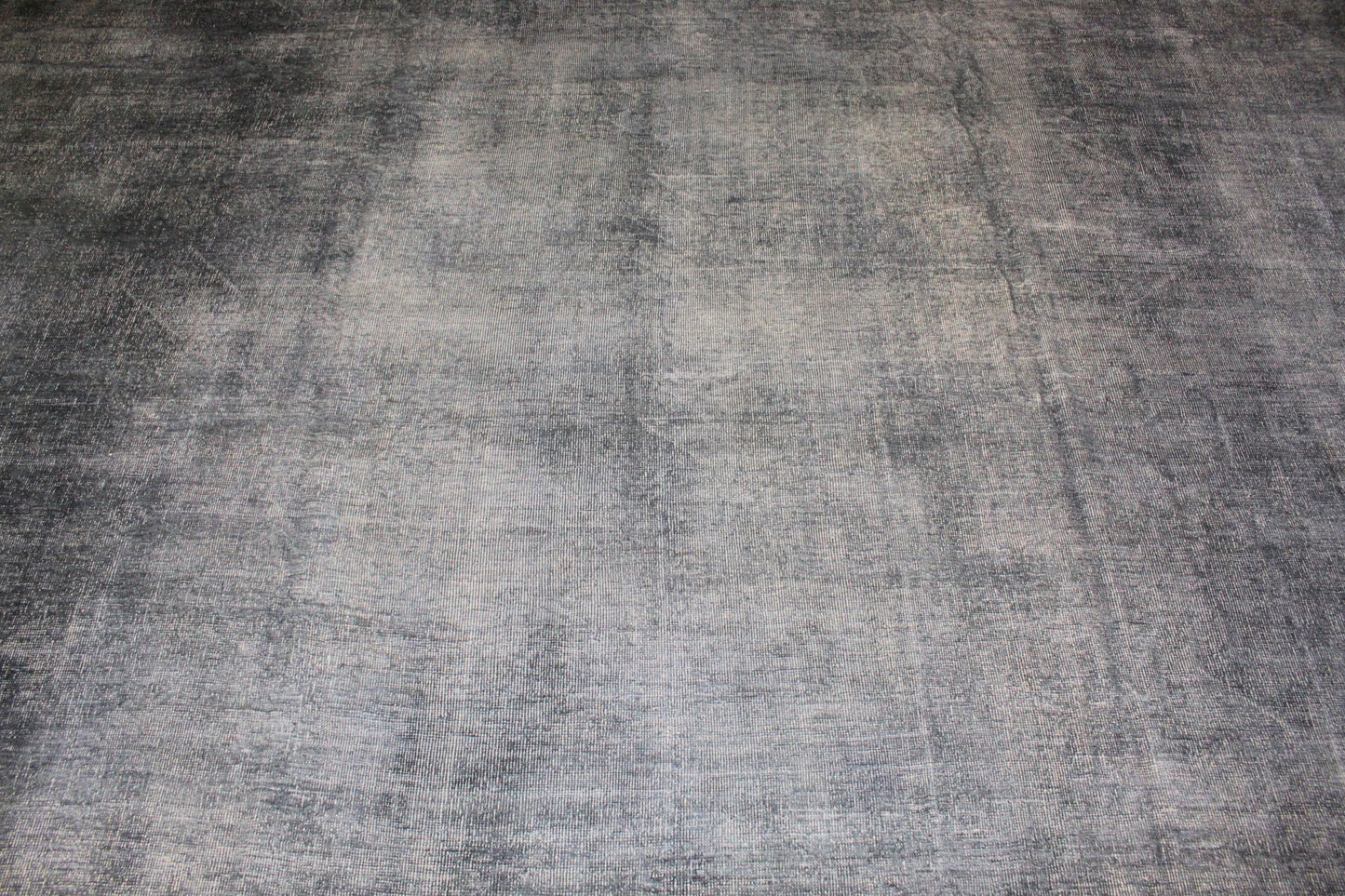 Textured gray rug with a checkered pattern