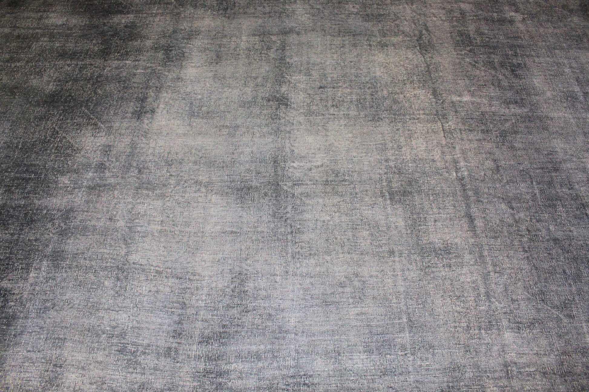 Textured gray rug with a checkered pattern