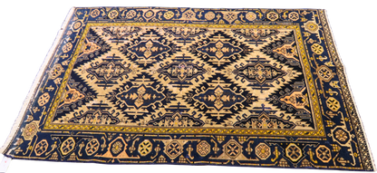antique Persian accent rug with soft peach tones

