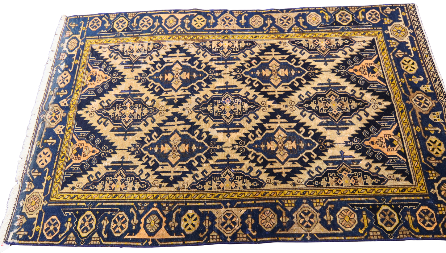 collectible Malayer rug with worn geometric motifs
