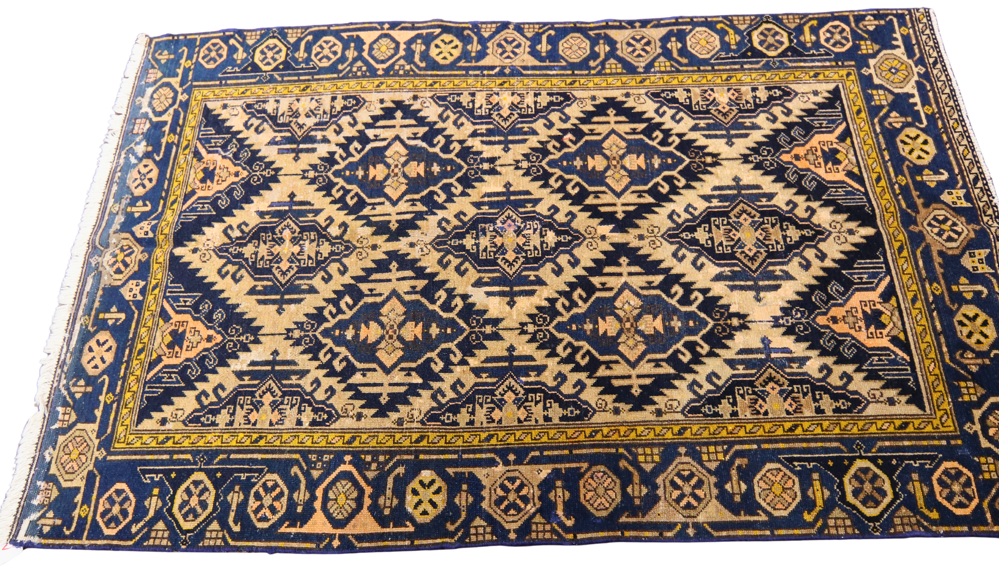collectible Malayer rug with worn geometric motifs