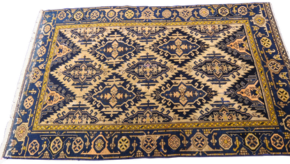collectible Malayer rug with worn geometric motifs