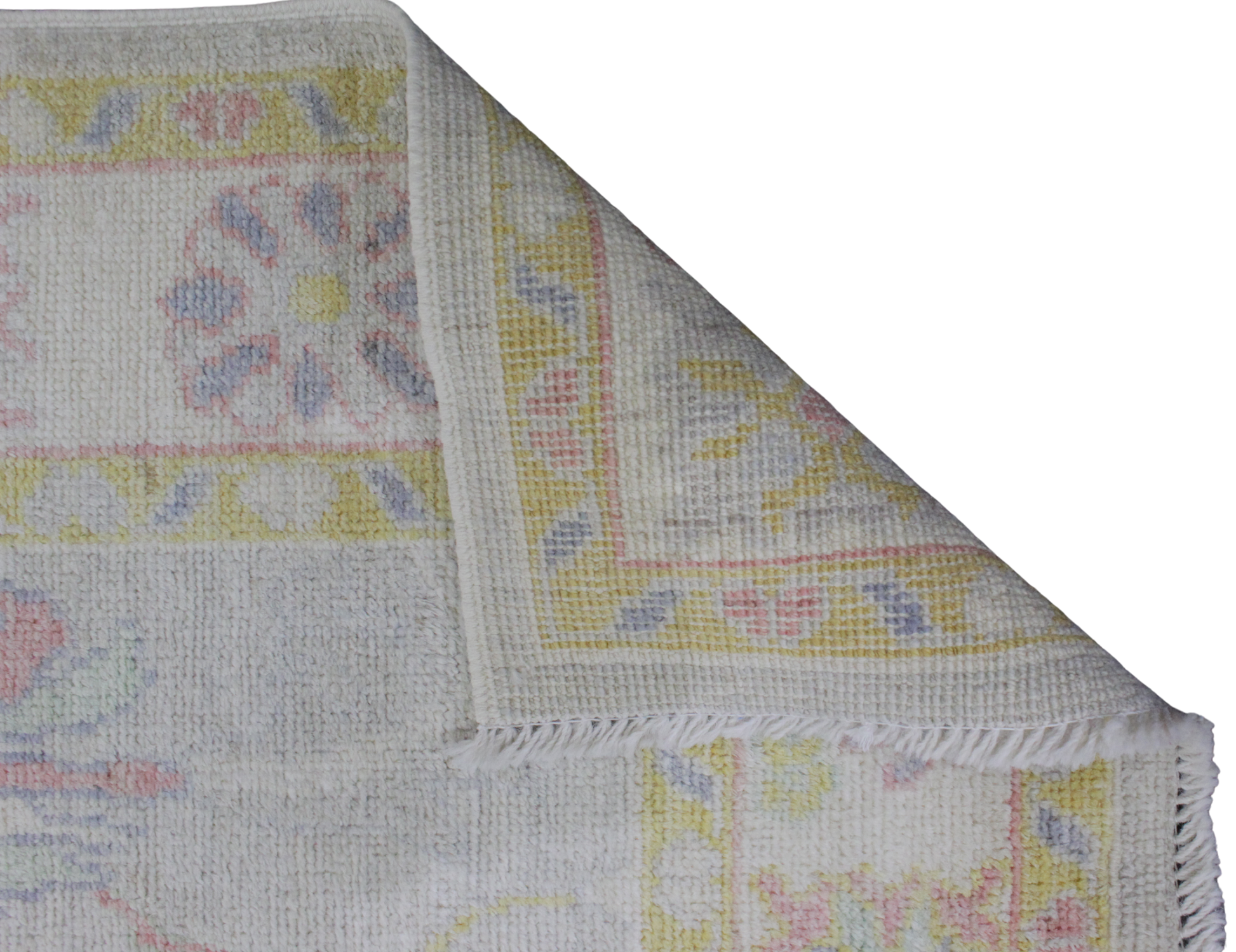 whimsical border Oushak rug in baby pink and blue